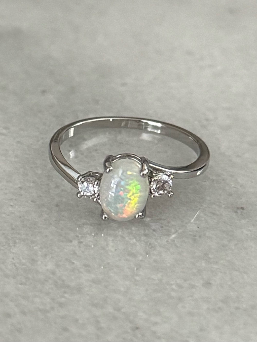 Silver Oval Opal Crystal Twist Ring 

Brand New 

Stainless Steel
